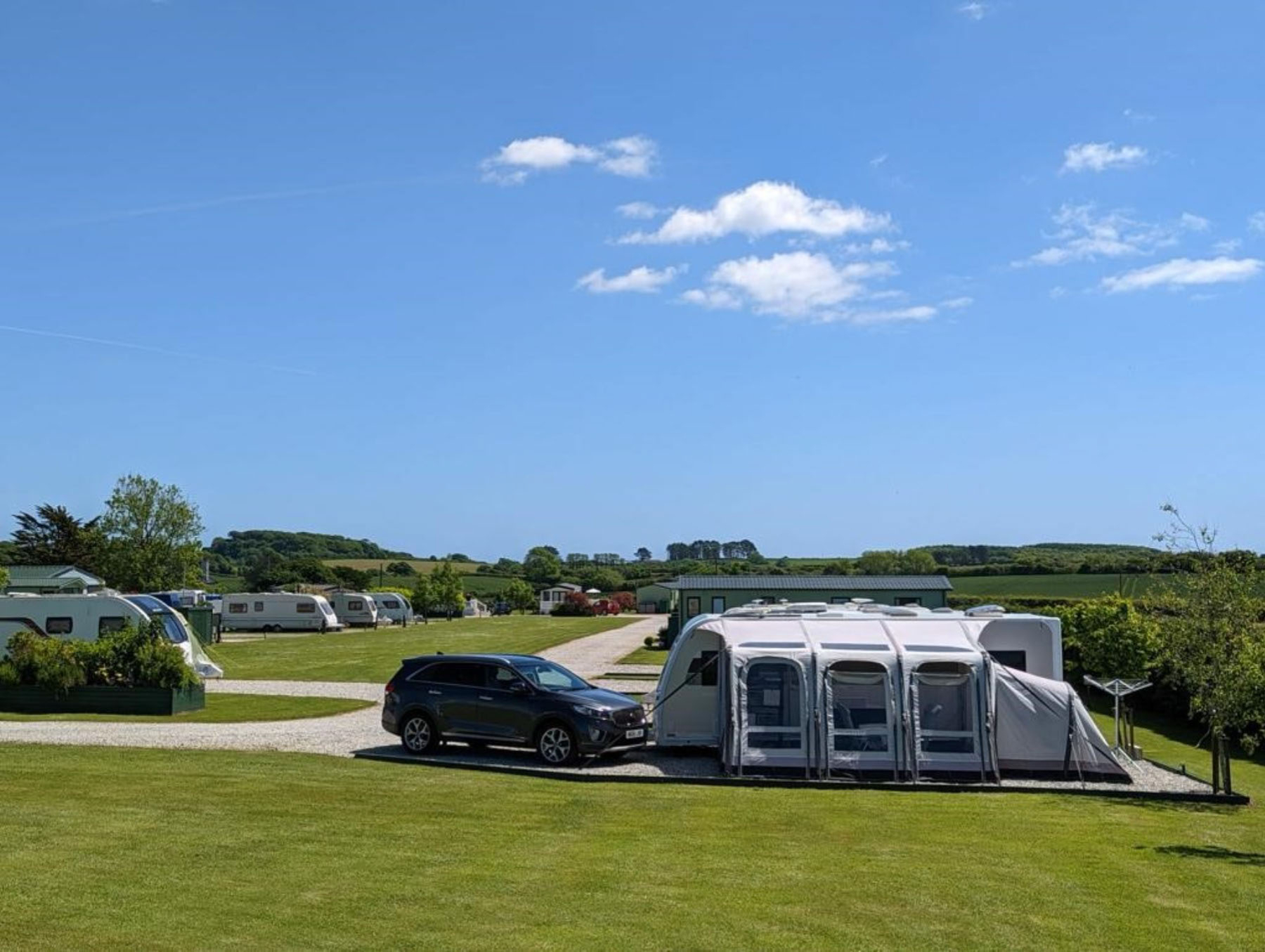 Image shows touring facilities at Trelay Holiday Park in Cornwall
